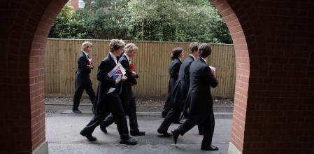 ETON, ENGLAND - JULY 20: Boys make their way to classes at Eton College on July 20, 2008, in Eton, England. An icon amongst private schools, since its founding in 1440 by King Henry VI, Eton has educated 18 British Prime Ministers, as well as prominent authors, artists and members of royal families from around the world. The school caters for some 1300 pupils divided into 25 houses each one overseen by a housemaster chosen from the senior ranks of the staff which number around 160. (Photo by Christopher Furlong/Getty Images)
