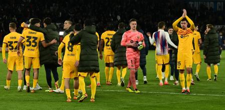 Barcelona's German goalkeeper #01 Marc-Andre ter Stegen (C-R) and Barcelona's Danish defender #15 Andreas Christensen (R) react at the end of the UEFA Champions League quarter final first leg football match between Paris Saint-Germain (PSG) and FC Barcelona at the Parc des Princes stadium in Paris on April 10, 2024. (Photo by MIGUEL MEDINA / AFP)