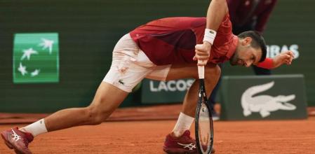 Serbia's Novak Djokovic slipped during his fourth round match of the French Open tennis tournament against Argentina's Francisco Cerundolo at the Roland Garros stadium in Paris, Monday, June 3, 2024. (AP Photo/Thibault Camus)