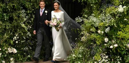 Groom Hugh Grosvenor, Duke of Westminster, and bride Olivia Henson pose for a photograph as they leave after their wedding service at Chester Cathedral in Chester, northern England, on June 7, 2024. (Photo by Oli SCARFF / AFP)