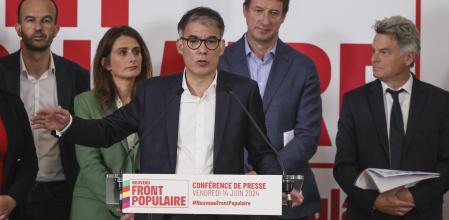 Socialist Party Secretary General Olivier Faure gestures a he speaks during a media conference for the upcoming election as far-left Manuel Bompard, Green Party Marine Tondelier, Green Party Yannick Jadot, and Communist Party national secretary Fabien Roussel stand behind him in Paris, Friday, June 14, 2024. Leaders of France's left-wing parties, allied in a coalition known as the New Popular Front on Friday outlined their plan to fend off the far-right from claiming power at the upcoming snap national election. (AP Photo/Thomas Padilla)