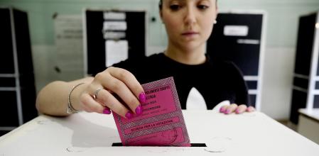 ROME, ITALY - JUNE 8: Voter places the ballot paper in the ballot box after casting her vote for the Italian candidates for the European Parliament, on June 8, 2024 in Rome, Italy. Voters in 27 European Union countries go to the polls over the next four days to elect members of the European Parliament.(Photo by Simona Granati - Corbis/Corbis via Getty Images)