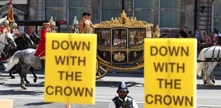 LONDON, ENGLAND - JULY 17: King Charles III and Queen Camilla are driven to Parliament in a state carriage as Republic, an anti monarchy group, protest along the procession's route, near to the Houses of Parliament, on July 17, 2024 in London, England. King Charles III delivers the King's Speech setting out the new Labour government's policies and proposed legislation for the coming parliamentary session. (Photo by Peter Nicholls/Getty Images)