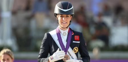 10 September 2023, North Rhine-Westphalia, Riesenbeck: Equestrian sport: European Championship, Dressage, Grand Prix Freestyle. British dressage rider Charlotte Dujardin (bronze) stands on the podium at the award ceremony. Photo: Friso Gentsch/dpa (Photo by Friso Gentsch/picture alliance via Getty Images)