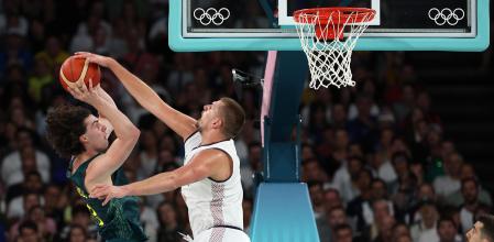 PARIS, FRANCE - AUGUST 06: Nikola Jokic #15 of Team Serbia blocks the shot of Josh Giddey #3 of Team Australia during the Men's Quarterfinal match between Team Australia and Team Serbia on day eleven of the Olympic Games Paris 2024 at Bercy Arena on August 06, 2024 in Paris, France. (Photo by Jamie Squire/Getty Images)