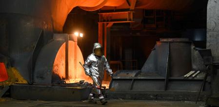 (FILES) An employee walks at blast furnace 8 at the Thyssenkrupp Steel Europe in Duisburg, western Germany on May 2, 2023. German industrial conglomerate Thyssenkrupp reported a quarterly loss on August, 14, 2024, weighed down by poor market conditions and as it struggles to restructure its steel division. The steel-to-submarines group lost 54 million euros ($59 million) from April to June, compared with a net profit of 83 million euros in the same quarter a year earlier. (Photo by Ina FASSBENDER / AFP)