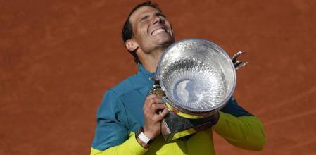 FILE - Spain's Rafael Nadal lifts the trophy after winning the final match against Norway's Casper Ruud in three sets, 6-3, 6-3, 6-0, at the French Open tennis tournament in Roland Garros stadium in Paris, France, Sunday, June 5, 2022, as he has announced he will retire from tennis at age 38 following the Davis Cup finals in November. (. (AP Photo/Christophe Ena, File)