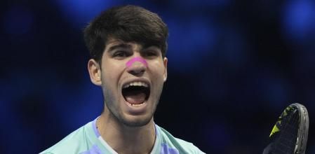 Spain's Carlos Alcaraz celebrates after winning the singles tennis match of the ATP World Tour Finals against Russia's Andrey Rublev, at the Inalpi Arena, in Turin, Italy, Wednesday, Nov. 13, 2024. (AP Photo/Antonio Calanni)