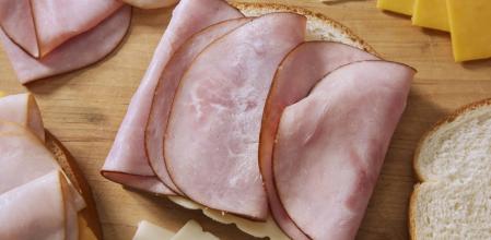 Preparing a Monte Cristo Sandwich, with Black Forest Ham, Smoked Turkey Breast, Cheddar and Swiss Cheese