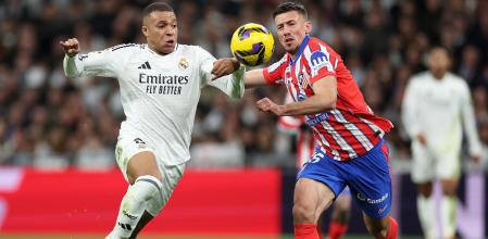 MADRID, SPAIN - FEBRUARY 08: Kylian Mbappe of Real Madrid is challenged by Clement Lenglet of Atletico de Madrid during the LaLiga match between Real Madrid CF and Atletico de Madrid at Estadio Santiago Bernabeu on February 08, 2025 in Madrid, Spain. (Photo by Florencia Tan Jun/Getty Images)