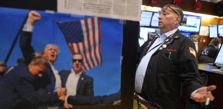 Jonathan Mueller works on the floor at the New York Stock Exchange in New York, Wednesday, April 2, 2025. (AP Photo/Seth Wenig)