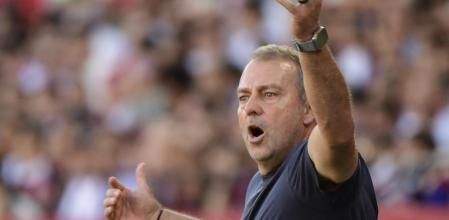 Barcelona's German coach Hans-Dieter Flick reacts during the Spanish league football match between Sevilla FC and FC Barcelona at Ramon Sanchez Pizjuan Stadium in Seville on October 5, 2025. (Photo by CRISTINA QUICLER / AFP)