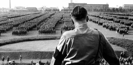 GERMANY - CIRCA 1930:  Adolf Hitler (1889-1945), German politician, during a parade.  (Photo by Roger Viollet via Getty Images)