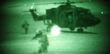 Undated photo taken at night using Night Vision Goggles (NVG), of members of 3rd Regiment Air Assault Corps, 16 Air Assault Brigade, at Camp Eagle, Kuwait. A 653 Squadron Lynx helicopter refuels at a FARP - a Forward Armning and Refuelling Point. (Photo by PA Images via Getty Images)