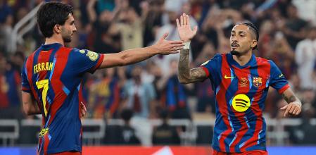 Soccer Football - Spanish Super Cup - Semi Final - FC Barcelona v Athletic Bilbao - King Abdullah Sports City, Jeddah, Saudi Arabia - January 7, 2026 FC Barcelona's Raphinha celebrates scoring their fourth goal with Ferran Torres REUTERS/Stringer