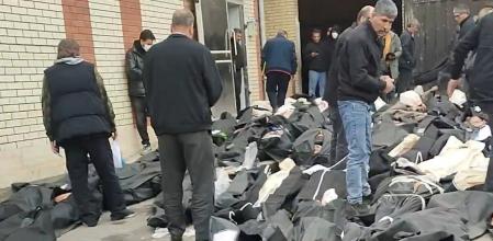 SENSITIVE MATERIAL. THIS IMAGE MAY OFFEND OR DISTURB Bodies lie in body bags on the ground as people stand amid the scene outside Kahrizak Forensic Medical Centre in Tehran, Iran, in this screen capture from a video obtained from social media, January 11, 2026. Social Media/via REUTERS THIS IMAGE HAS BEEN SUPPLIED BY A THIRD PARTY. MANDATORY CREDIT. NO RESALES. NO ARCHIVES. Verification: Location confirmed from buildings, road layout which matched file and satellite imagery of the area Date could not be independently verified