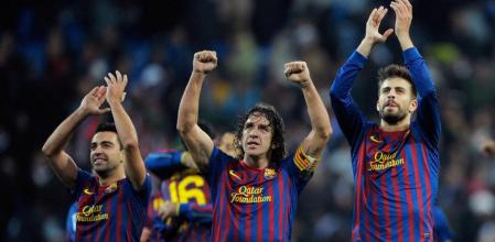 Xavi, Puyol y Piqué celebran la victoria del Barça