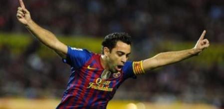 Xavi Hernandez celebra su gol ante el Sevilla
