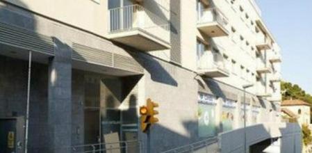 Fachada de la promoción de vivienda pública La Pedrera, en Vallvidrera, Barcelona