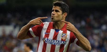 El delantero brasileño Diego Costa celebra tras marcar ante el Real Madrid