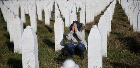 A woman reacts near a grave of her family members in the Memorial centre Potocari near Srebrenica, Bosnia and Herzegovina, after the court proceedings of former Bosnian Serb general Ratko Mladic, November 22, 2017. REUTERS/Dado Ruvic