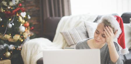 young woman in christmas interior with laptop