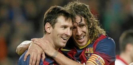 Leo Messi y Carles Puyol en su etapa barcelonista