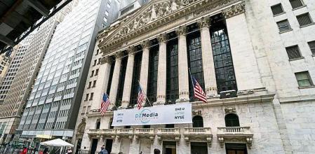 Pedestrians pass the New York Stock Exchange, Wednesday, Jan. 27, 2021, in New York. Major indexes opened lower on Wall Street Friday, Jan. 29, while shares of GameStop, AMC and several other stocks being targeted by a rowdy community of amateur investors soared again. (AP Photo/John Minchillo)