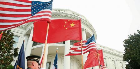 FILE - In this Sept. 25, 2015, file photo, a military honor guard await the arrival of President Barack Obama and Chinese President Xi Jinping for a state arrival ceremony on the South Lawn of the White House in Washington. (AP Photo/Andrew Harnik, File)