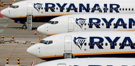 (FILES) In this file photo taken on August 20, 2020 Ryanair aircraft are pictured at Stansted airport, northeast of London. - Irish low-cost airline Ryanair on February 17 lost its attempt in an EU court to block massive public bailouts of rival companies such as Air France and SAS, a statement said. (Photo by Adrian DENNIS / AFP)