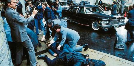 March 30, 1981 - Washington, District of Columbia, U.S. - Assassination attempt (#5 of 9 in a sequence) on U.S. President RONALD WILSON REAGAN outside the Washington Hilton Hotel. President's Press Secretary JAMES BRADY and Police Officer THOMAS DELAHANTY (shot in the neck and shoulder) lie wounded on the ground. Secret Service Agents grab the attacker, would-be assassin John Warnock Hinckley Jr., just moments after he fired his pistol. Also wounded in the attack were, Secret Service Agent TIMOTHY MCCARTY (shot in the stomach). (Credit Image: Michael A. W. Evans/ZUMAPRESS.com)