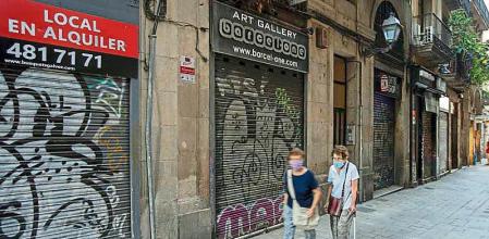 FOTO : MANÉ ESPINOSA. PARA REPORTAJE “ CENTRO DE BARCELONA” IMAGEN DE MUCHO DE LOS LOCALES COMERCIALES DEL CENTRO CERRADOS POR ERTES O EN TRASPASO
