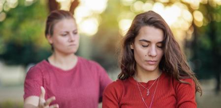 Young sad mad sitting by the window in regret