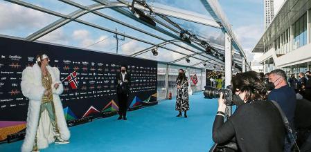 Tix, left, from Norway poses for photographers upon arrival at the Turquoise Carpet event of the Eurovision Song Contest in Rotterdam, Netherlands, Sunday, May 16, 2021. (AP Photo/Peter Dejong)