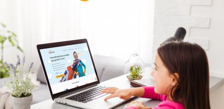 little girl studying with computer