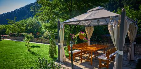 Pergola at a beautiful green garden