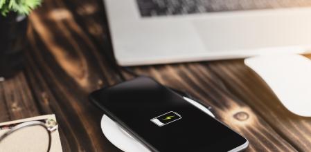 close-up phone charging on wireless charger device