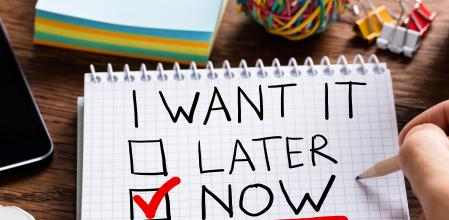 Man Writing I Want It Now In Diary At Desk