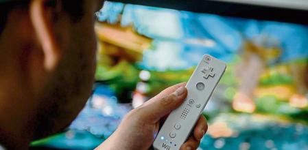 02 April 2020, Berlin: A young man is playing with the game console Wii. To prevent infection with the corona virus, many people spend their free time at home. Photo: Britta Pedersen/dpa-Zentralbild/dpa (Photo by Britta Pedersen/picture alliance via Getty Images)