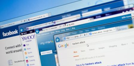 Bucharest, Romania - April 4, 2014:close-up of Facebook.com, Yahoo.com, MSN.com and Google.com main pages in Internet Explorer with hackers attack search criteria