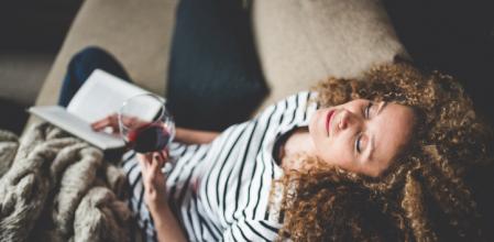 Relaxed young woman reading a book