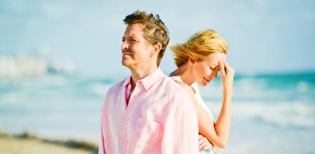 Beautiful Happy Mature Couple Walking on the beach