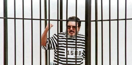 (FILES) In this file photo taken on October 14, 1992 Shining Path leader Abimael Guzman exhausted his last appeal in Lima after a military court did not overturn his life sentence. - The historic leader of Peru's Maoist guerrilla group Shining Path, Abimael Guzman, died on September 11, 2021, at the age of 86, while serving a life sentence since 1992. The former university philosophy professor, hospitalized since July 20, spent his last 29 years in prison carrying on his back the intellectual responsibility for one of the bloodiest conflicts in Latin America, with 70,000 dead and disappeared in two decades (1980-2000) according to figures of the Truth and Reconciliation Commission (2003). (Photo by HECTOR MATA / AFP)