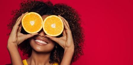 Beautiful afro girl with an orang