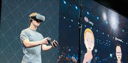 Facebook co-founder and chief executive, Mark Zuckerberg, speaks at an Oculus developers conference while wearing a virtual reality headset in San Jose, California on October 6, 2016. - Facebook unveiled new hardware for its Oculus division as part of a stepped-up effort to integrate virtual reality with the leading social network. The new offerings aim to get an array of virtual reality gear to consumers in the coming months, including a new 