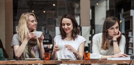 Group of women seated at a cafe's window relaxing during a cold afternoon in Scandinavia, Copenhagen.
