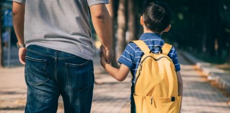 Father and son going to kindergarte