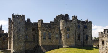 Alnwick Castle is a castle and stately home in Alnwick, Northumberland, England and the residence of the Duke of Northumberland, built following the Norman conquest, and renovated a number of times. The movies Blackadder and Harry Potter were filmed here.
