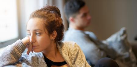 Shot of a young woman looking despondent after a fight with her boyfriend