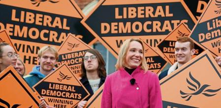 Newly elected Liberal Democrat lawmaker Helen Morgan, celebrates in Oswestry, Shropshire, England, Friday Dec. 17, 2021, following her victory in the North Shropshire by-election. U.K. Prime Minister Boris Johnsonâ#{emoji}128;#{emoji}153;s Conservative Party has suffered a stunning defeat in a parliamentary by-election that was a referendum on his government amid weeks of scandal and soaring COVID-19 infections. (Jacob King/PA via AP)